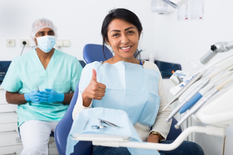 Patient smiling after a root canal